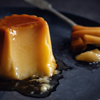 Free photo spanish dessert flan with sauce served on plate. closeup